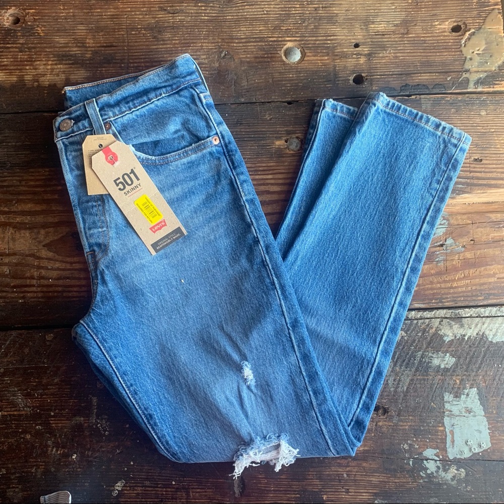 Levi’s 501 medium wash jeans distressed knee high waisted skinny button fly